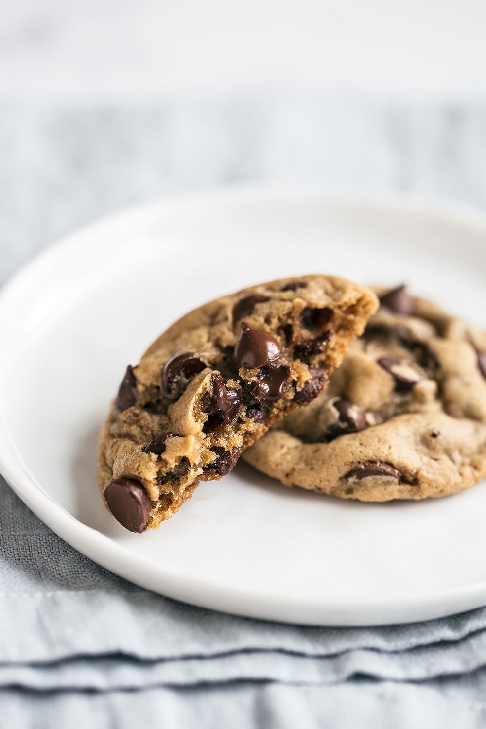 Soft Chocolate Chip Cookies are ultra ooey and gooey with two secret ingredients to keep them ultra soft and tender! Your friends will LOVE these cookies.