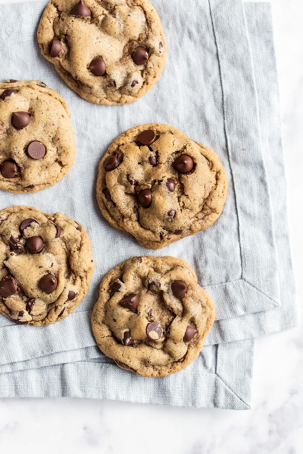 If you love SOFT and slightly gooey chocolate chip cookies you will be obsessed with this homemade recipe!
