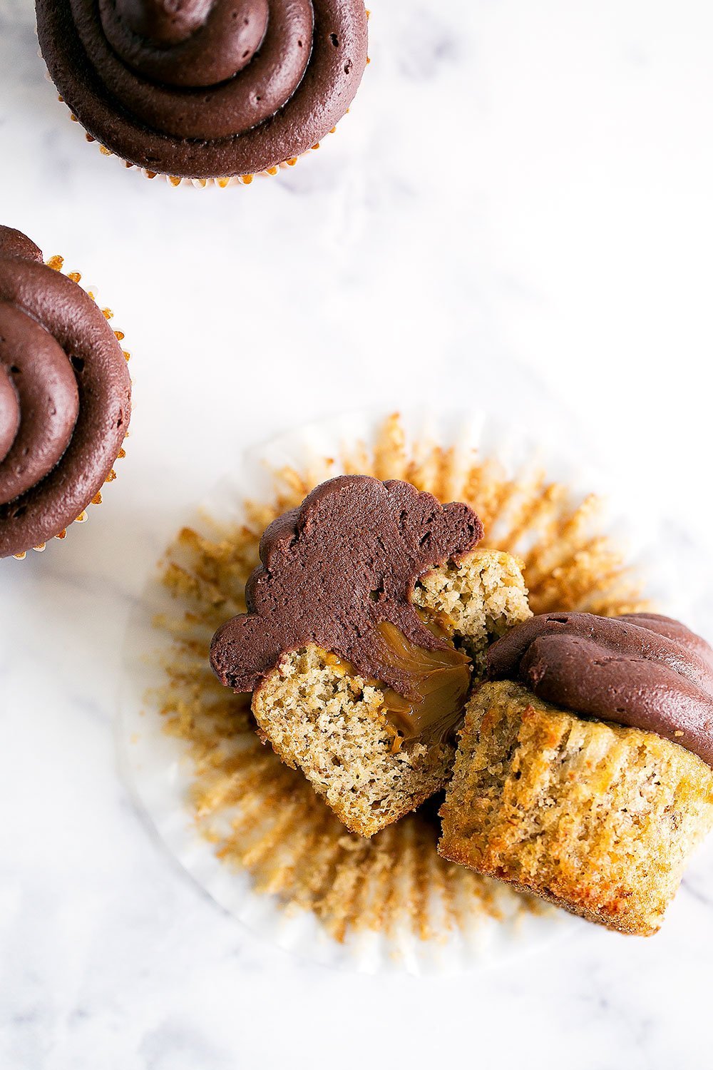 YUM! Dulce de Leche Banana Cupcakes with Chocolate Frosting are out of this world moist and flavorful!