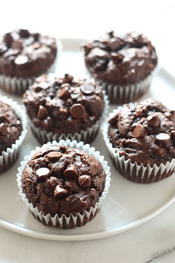 Chocolate Peanut Butter Banana Muffins are made healthier with whole wheat flour, no butter or oil, but tons of flavor! EASY 30 minute recipe.
