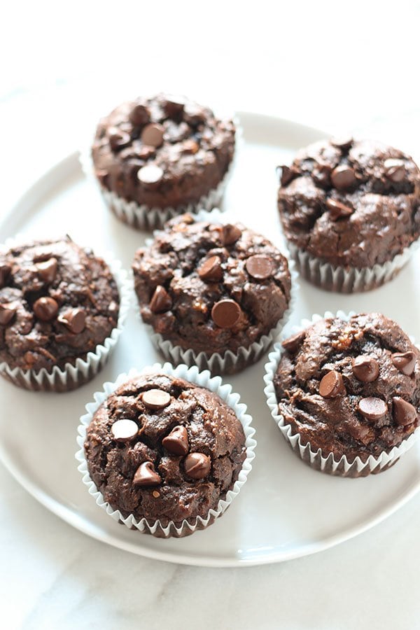 Chocolate Peanut Butter Banana Muffins are made healthier with whole wheat flour, no butter or oil, but tons of flavor! 30 minute recipe.