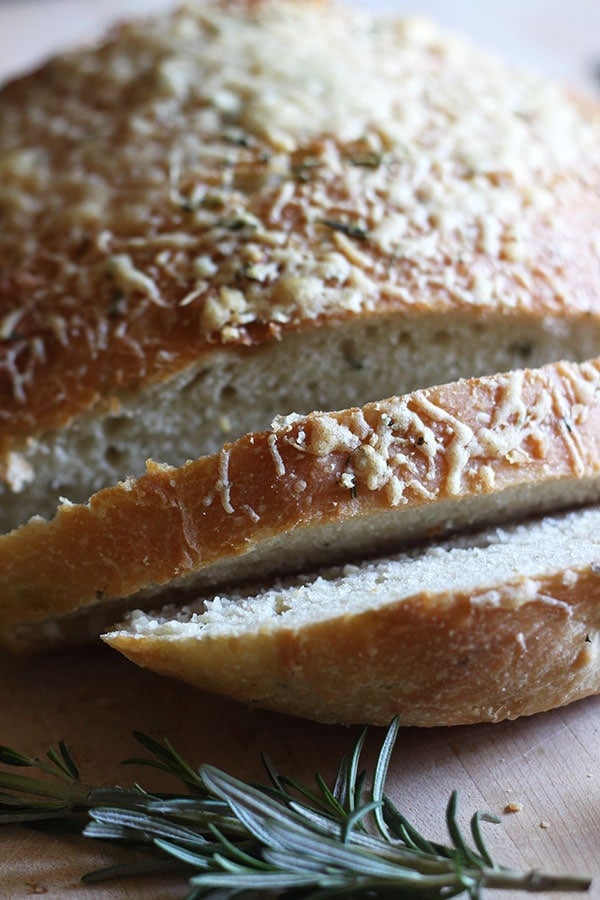 No Knead Rosemary Parmesan Skillet Bread features a super easy homemade dough that comes together in a matter of minutes! This bread has tons of flavor and a crispy crust.