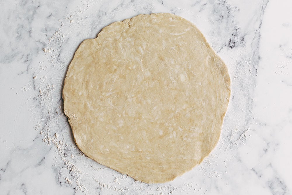 pie dough rolled out into a circle