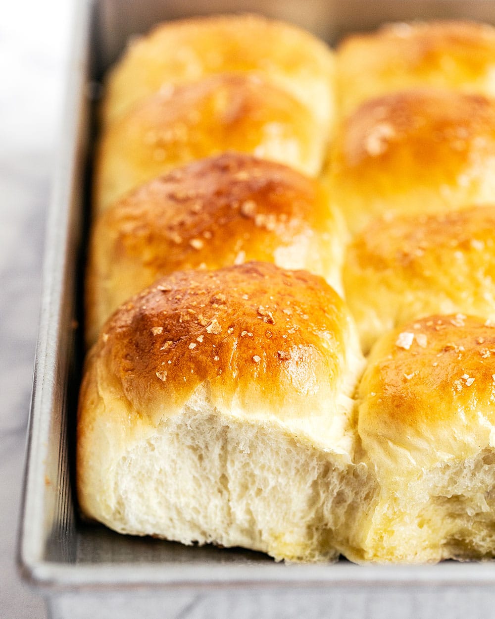 Tray of homemade soft and fluffy bread rolls
