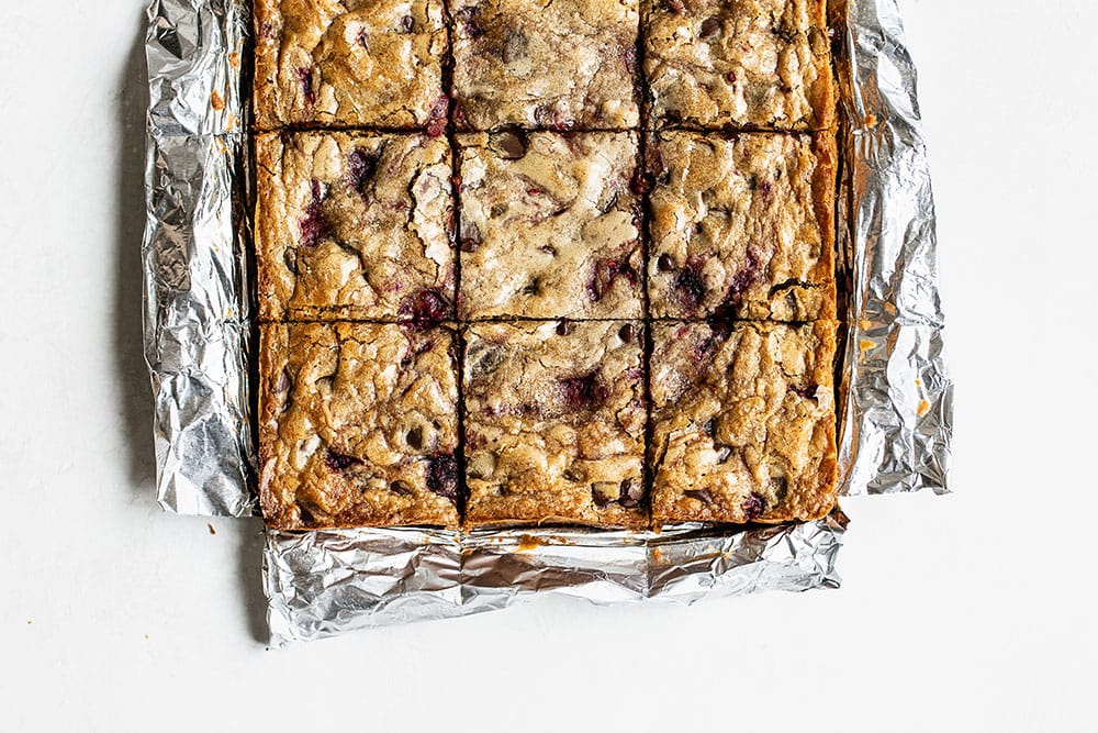 Dark Chocolate and Raspberry Blondies sliced into squares