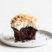 Easter Chocolate Coconut Cupcake on a plate with a bite taken out