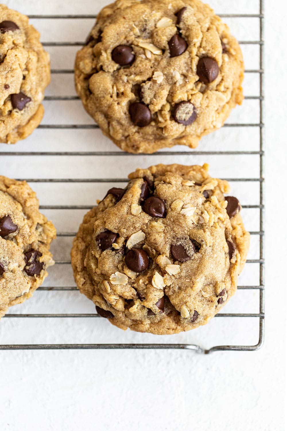 soft peanut butter oatmeal chocolate chip cookies on a cooling rack